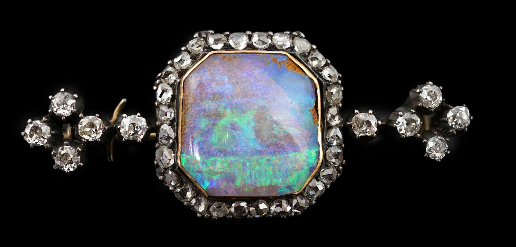 A late Victorian gold and silver, black opal and diamond cluster bar brooch